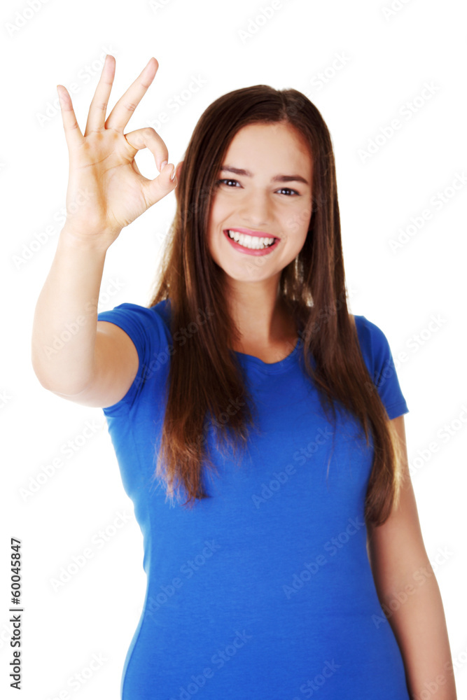 young casual woman student showin OK gesture. young casual woman student showin OK gesture.