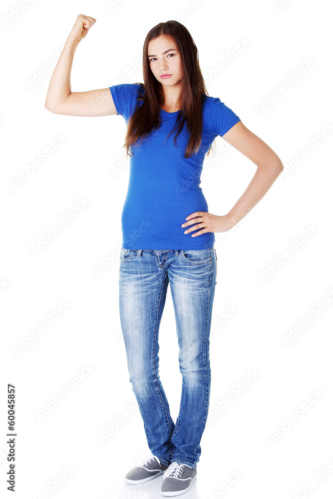Young beautiful woman showing her strenght and muscle. Young beautiful woman showing her strenght and muscle.