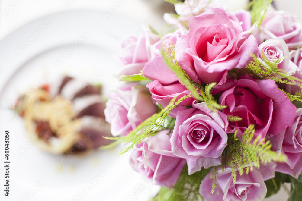 Pink rose flower on front of Beef medallions Pink rose flower on front of Beef medallions