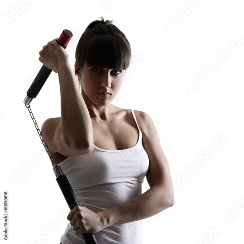 sport karate girl doing exercise with nunchaku, fitness woman si photo