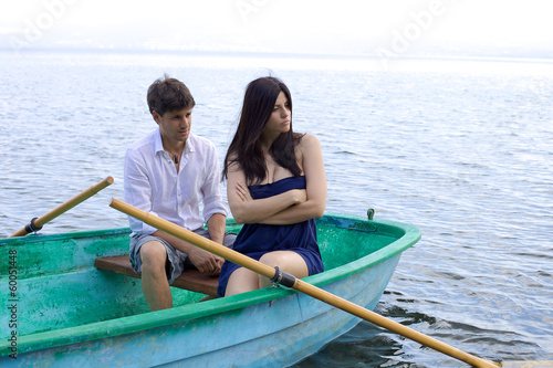 Sad young woman angry with husband in vacation