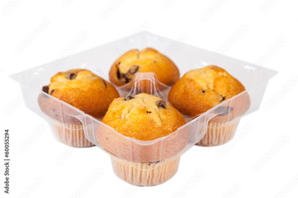 Vier Muffins in Plastikverpackung Vier Muffins in Plastikverpackung