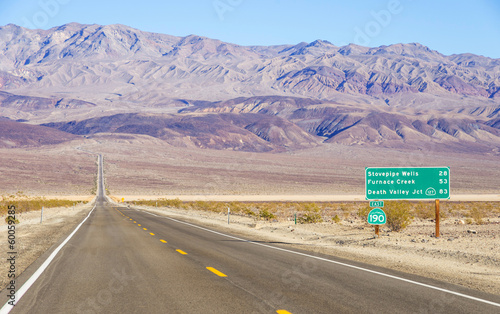 Death Valley landscape and road sign,California photo