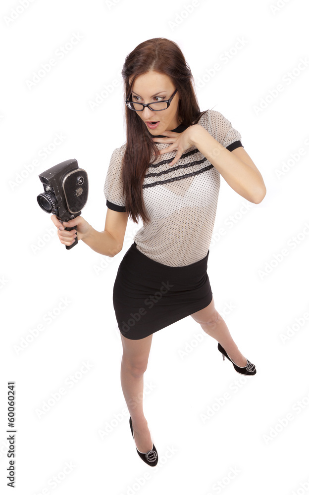 Girl with old movie camera on white background Girl with old movie camera on white background