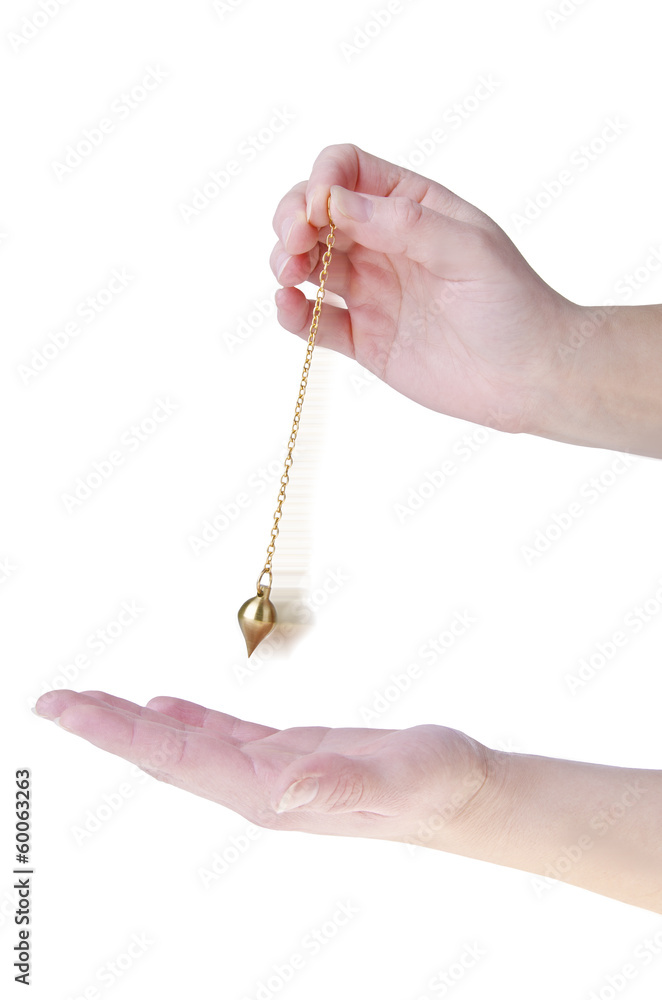 Close-up of a hand holding a golden pendulum over another hand, isolated on white background. Concept of spiritual guidance, energy reading, divination, and holistic healing practice. Close-up of a hand holding a golden pendulum over another hand, isolated on white background. Concept of spiritual guidance, energy reading, divination, and holistic healing practice.