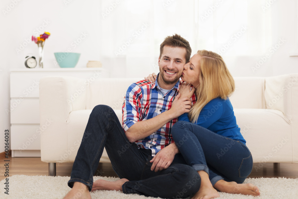Affectionate couple spending time together at home