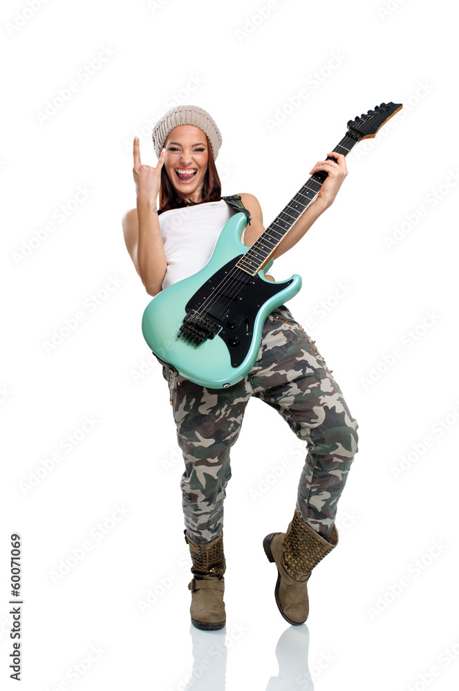 Beautiful young woman playing a guitar