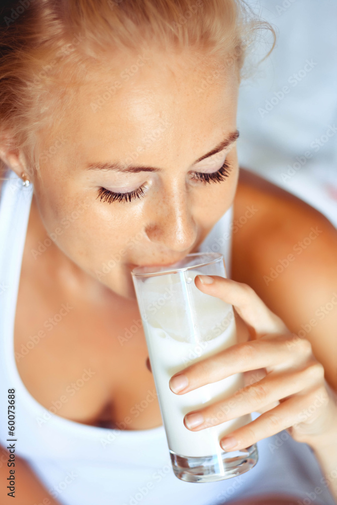woman drinking milk, indoors woman drinking milk, indoors