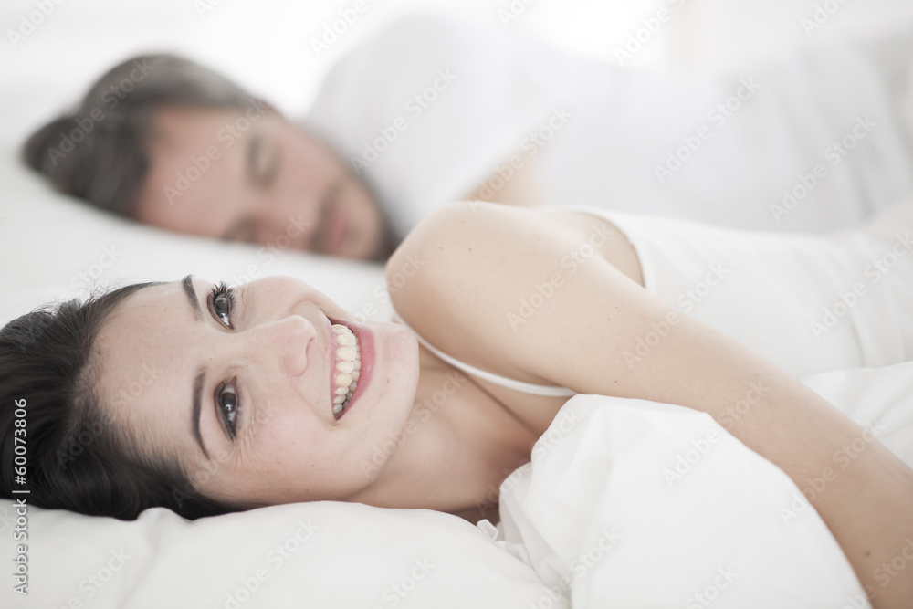 Romantic young couple  in bed
