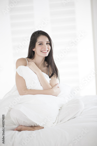 Beautiful woman on a bed