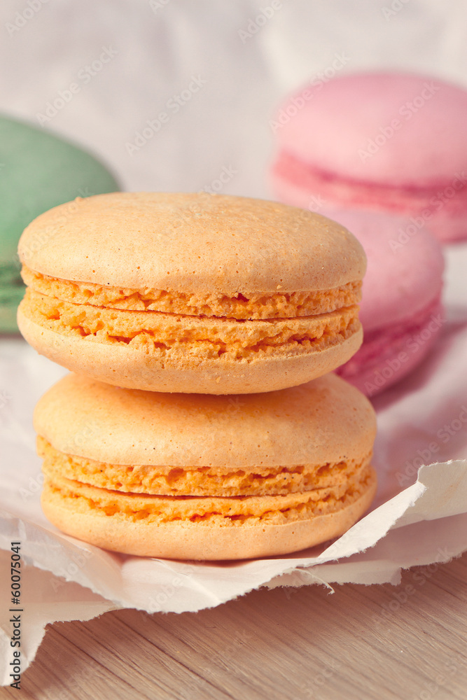 Multicolored macaroon on parchment Multicolored macaroon on parchment