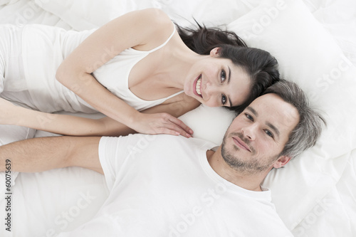 Lovely couple lying in bed