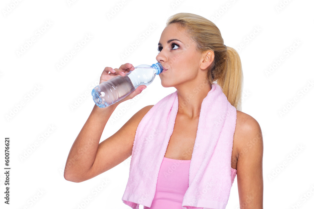 Attractive young fitness woman drinking water Attractive young fitness woman drinking water