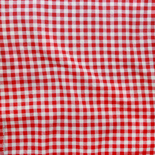 Texture of a red and white checkered picnic blanket.