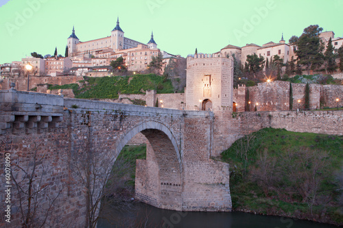 Toledo - Alcazar and Punte de Alcantara bridge in morning dusk