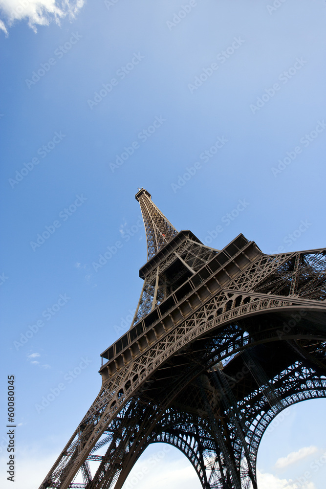 Close-Up view looking up at the Eiffel Tower in Paris, France - obrazy, fototapety, plakaty 