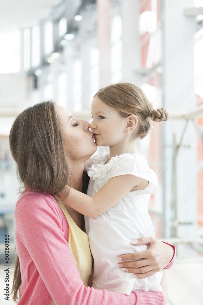 Mother and daughter hug and kiss Mother and daughter hug and kiss