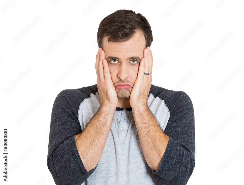 Closeup portrait of young man thinking, worried defeated Closeup portrait of young man thinking, worried defeated