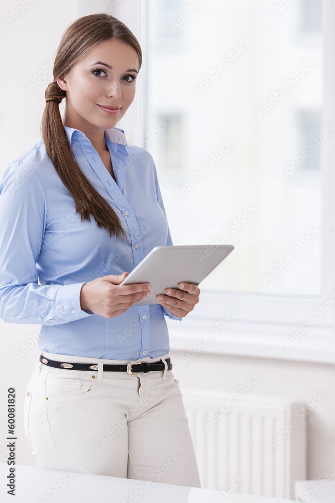 Beautiful businesswoman using tablet computer Beautiful businesswoman using tablet computer