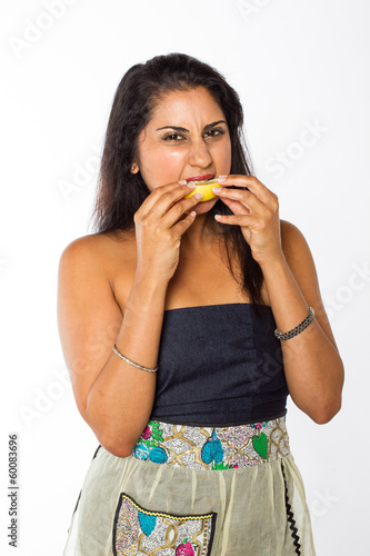 Indian Woman Eats Lemon
