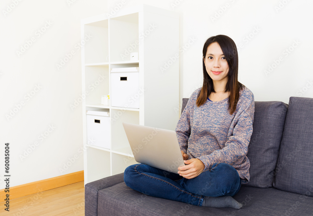 Asian woman using laptop at home Asian woman using laptop at home