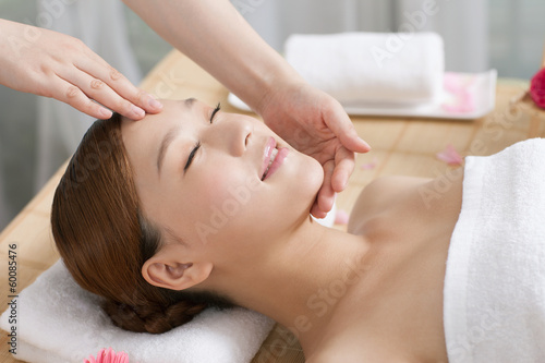 .A young woman enjoy massage.