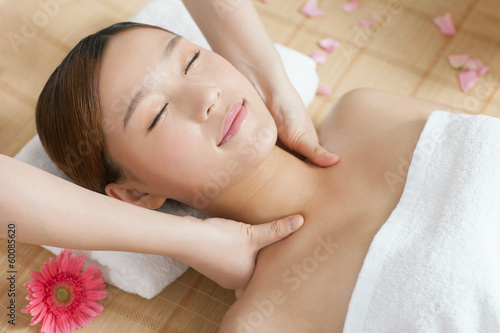 .A young woman enjoy massage.