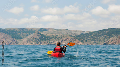 traveler kayaking in the thai ocean from backward view © Rock and Wasp