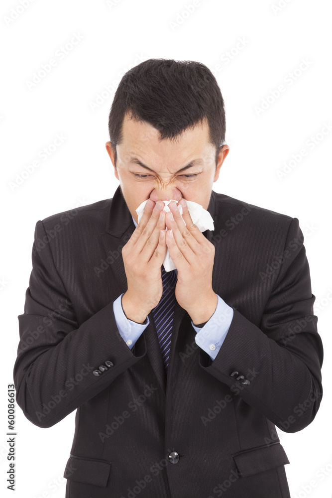 sick young businessman is sneezing with toilet paper sick young businessman is sneezing with toilet paper