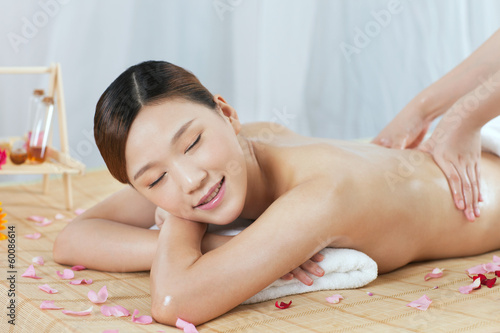 .A young woman enjoy massage.