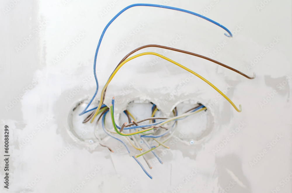 Fototapeta premium Undone AC power socket in wall. Repairs in the apartment.