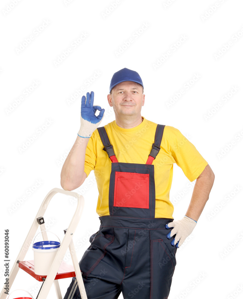 Worker on ladder showing sign okey. Worker on ladder showing sign okey.