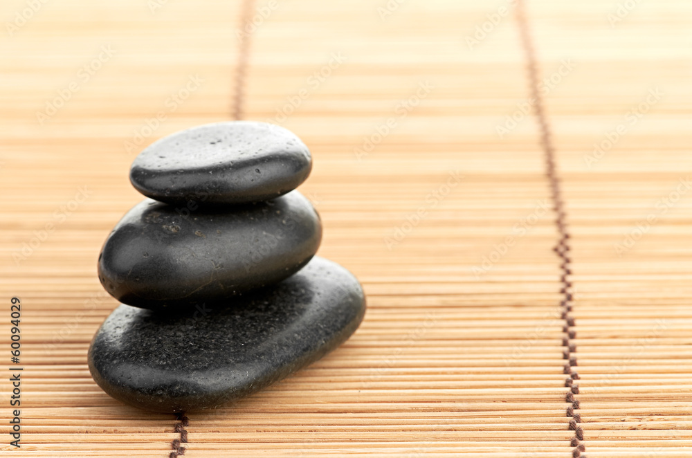 The spa a stone on bamboo background