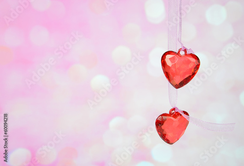 two red glass hearts