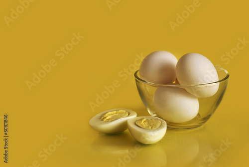 Hard-boiled eggs on a yellow background