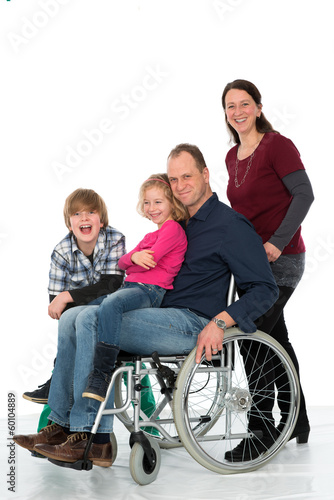 man in wheelchair with family