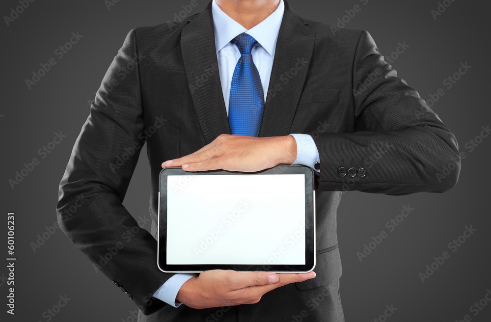 photo of a businessman showing blank tablet PC monitor photo of a businessman showing blank tablet PC monitor