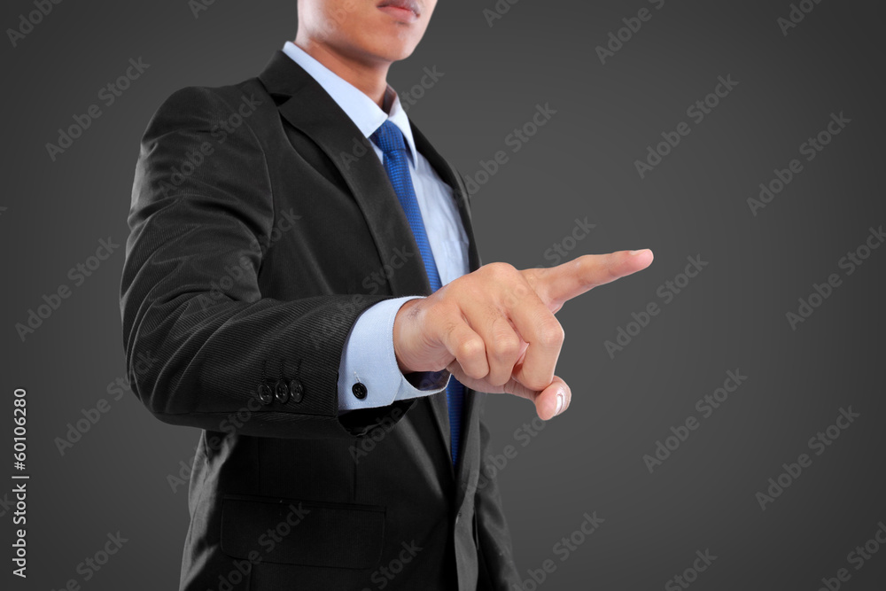 Business Man pushing on a touch screen interface Business Man pushing on a touch screen interface