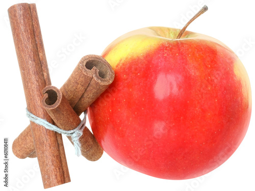 Three cinnamon sticks tied with a rope with red apple