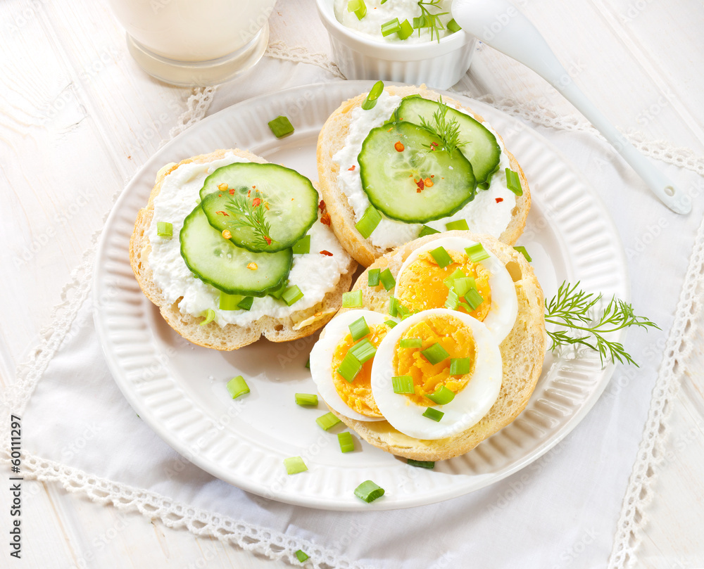 Fresh canapes with egg, cottage cheese, cucumber and herbs