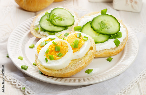 Fresh canapes with egg, cottage cheese, cucumber and herbs