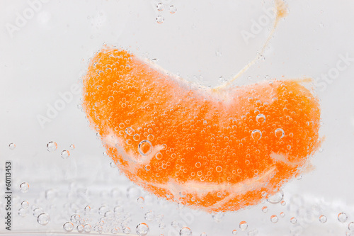 Orange (mandarin) falling in  water