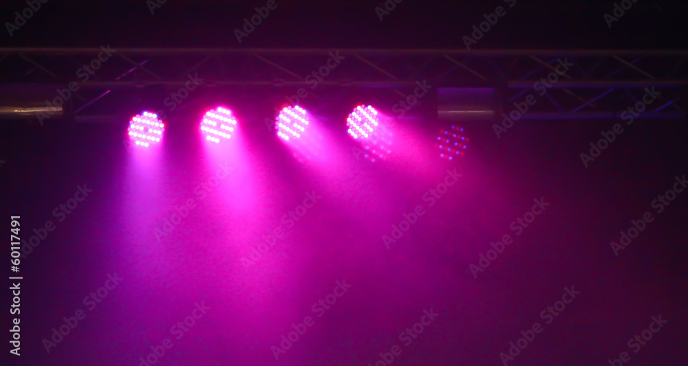 Image of colorful concert lighting against a dark background Image of colorful concert lighting against a dark background