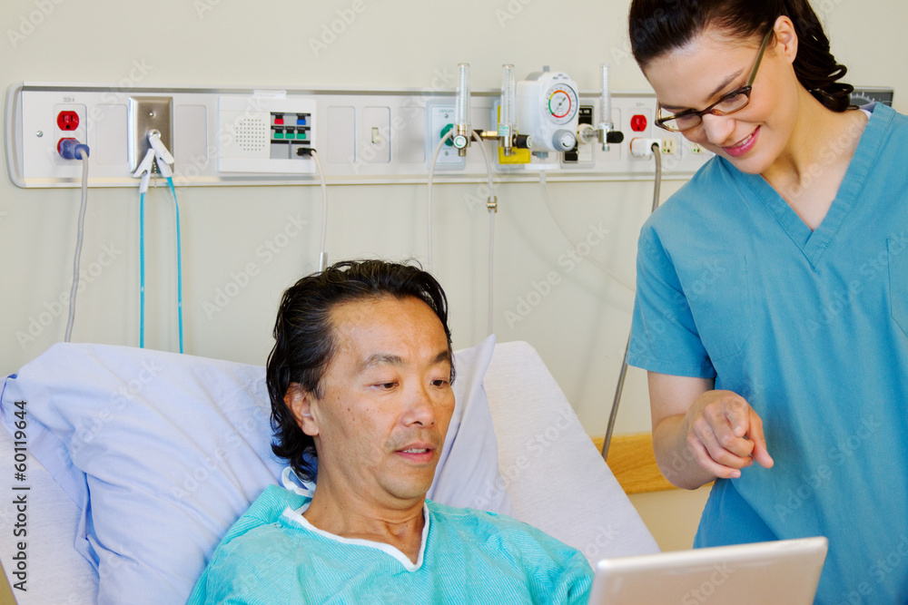 Patient and nurse looking at tablet Patient and nurse looking at tablet