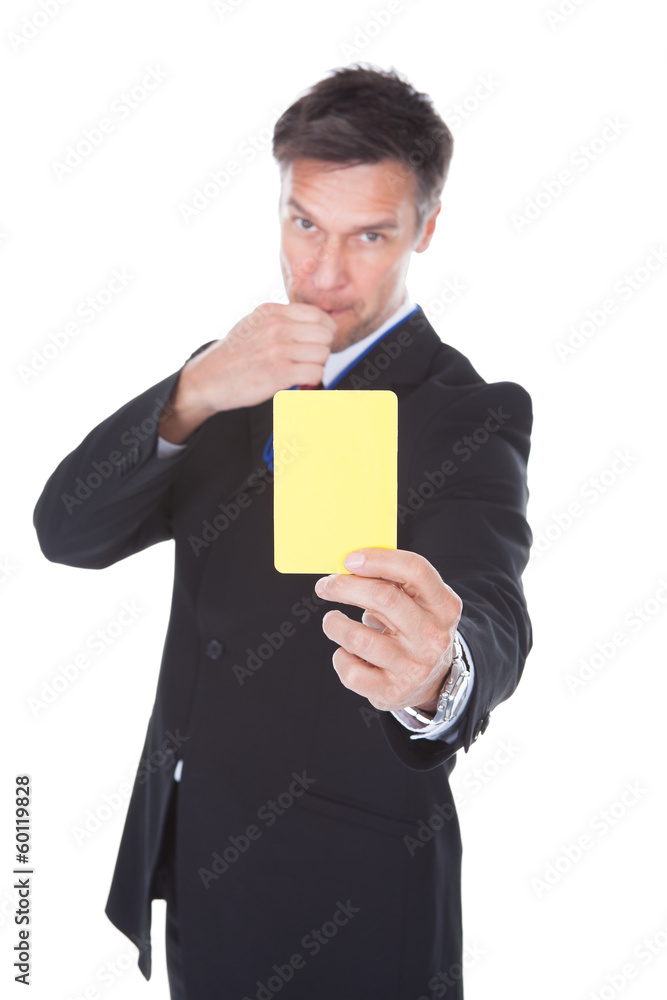 Businessman Showing Yellow Card Businessman Showing Yellow Card