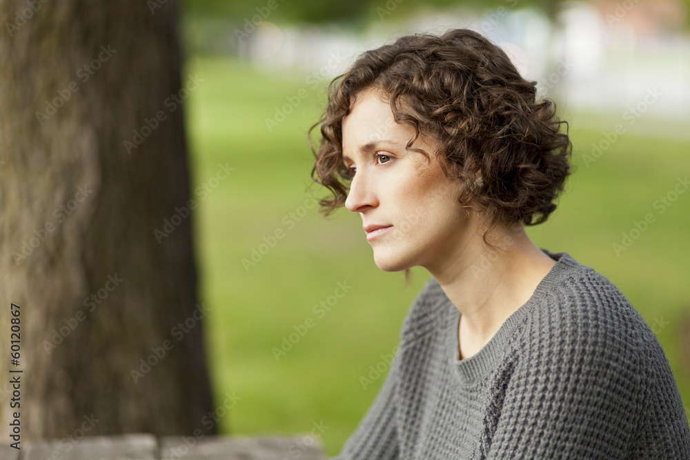 Mature woman thinking at the park Mature woman thinking at the park