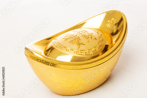 Bild auf Leinwand gold ingot in white background