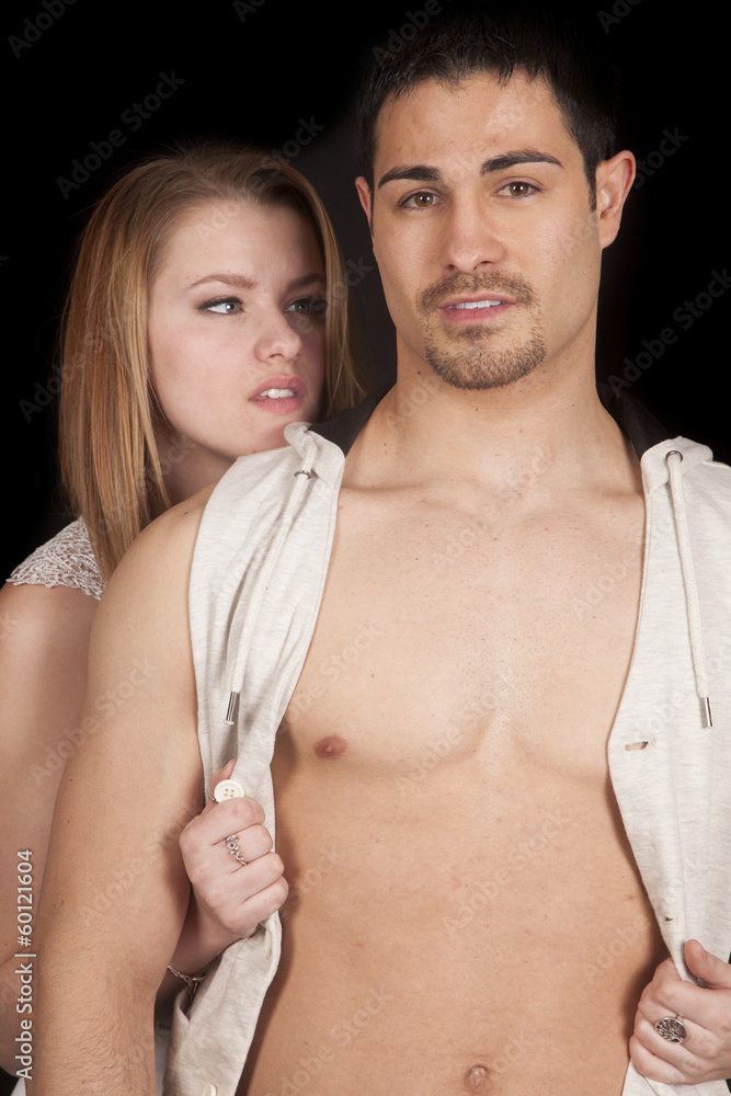 Woman behind man open vest him look Woman behind man open vest him look