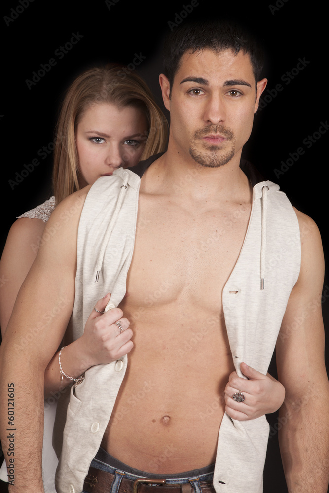 Woman behind man open vest serious Woman behind man open vest serious