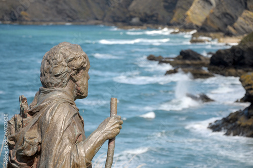 Statue overlooking bay at Llangrannog in Cardigan